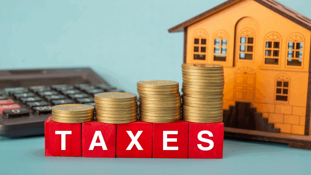 property_tax_July_spike House with coins for property tax spike blog